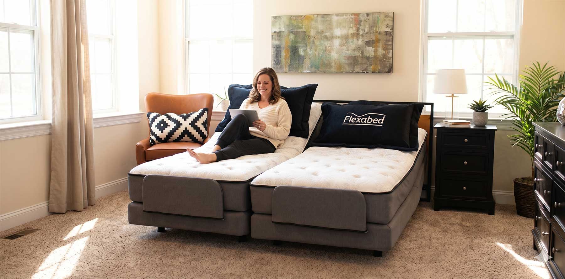 Happy woman sitting on a luxury, adjustable, king-size bed